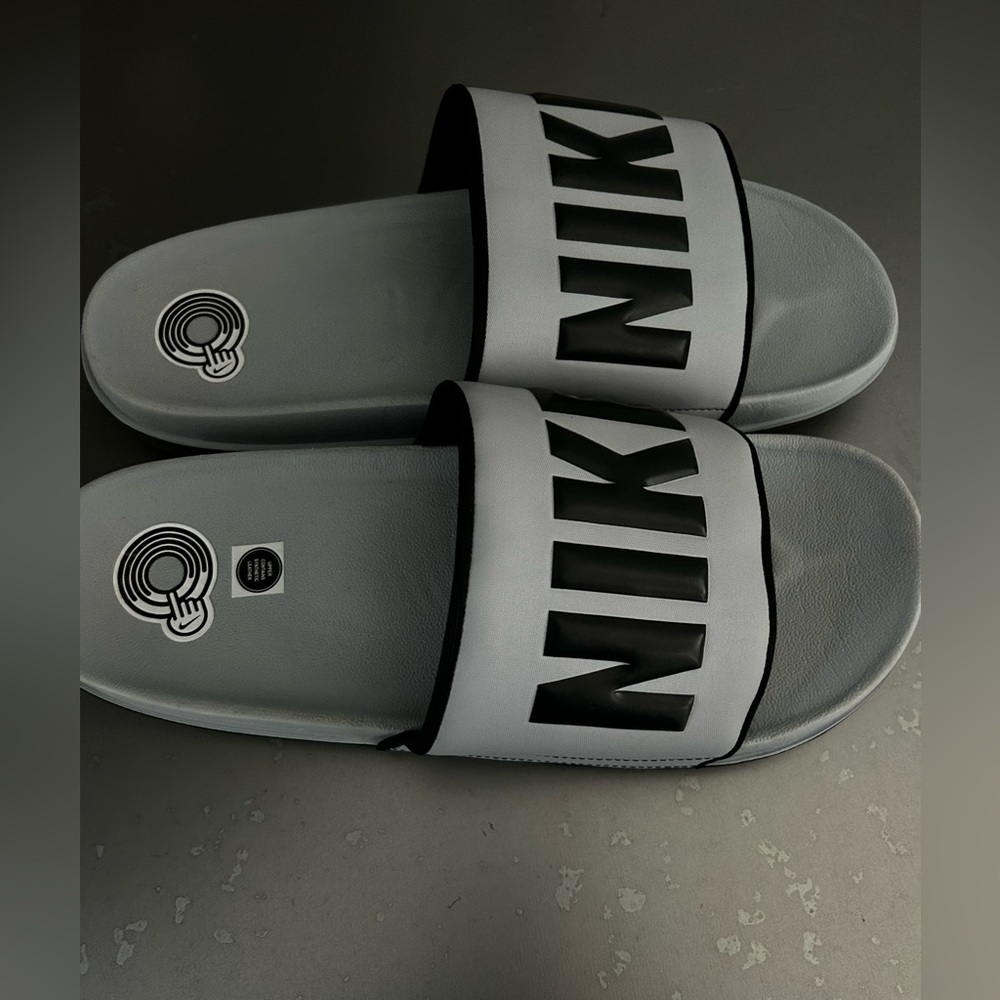 Brand new gray Nike slides. Size 13